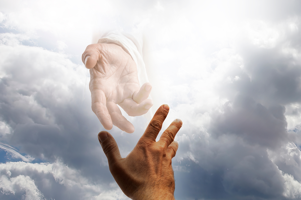 Hand of God reaching down from heaven